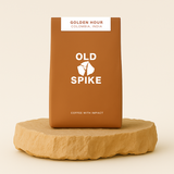 Graphic displaying Old Spike Roastery’s Coffee With Impact message, promoting social change through specialty coffee.