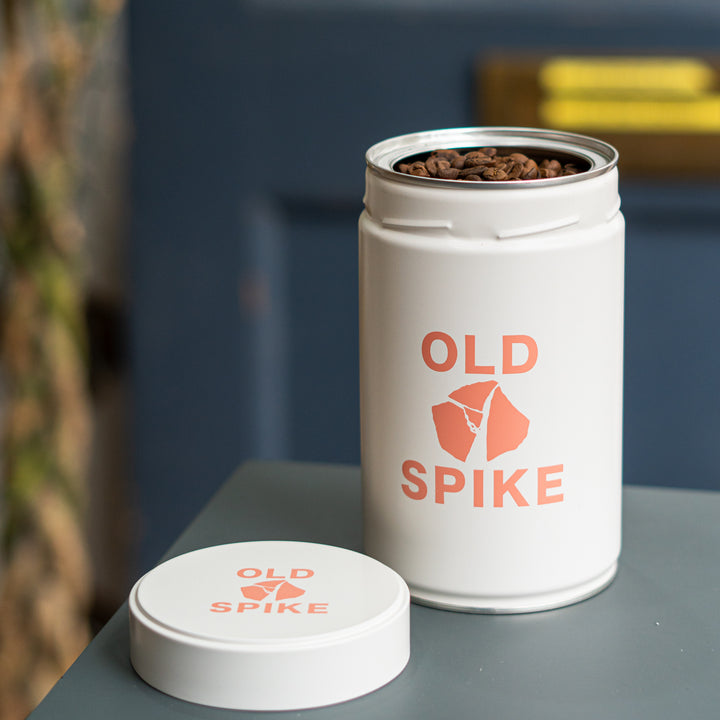Old Spike reusable white coffee tin filled with coffee beans